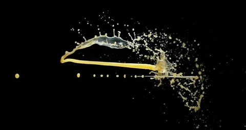 Orange Juice Exploding and Splashing on Black Background, Slow Motion 4K Stock Footage 120040819