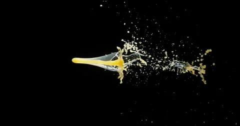 Orange Juice Exploding and Splashing on Black Background Stock Photos