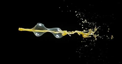 Orange Juice Exploding and Splashing on Black Background Foto stock