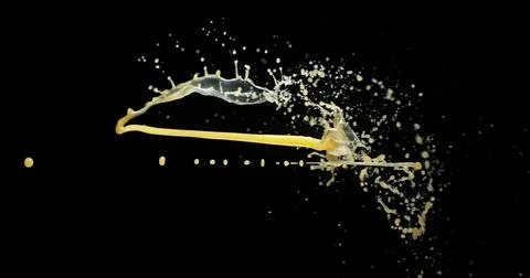 Orange Juice Exploding and Splashing on Black Background Stock Photos
