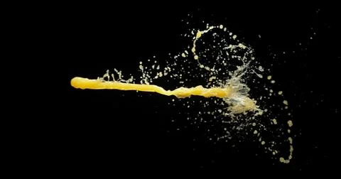 Orange Juice Exploding and Splashing on Black Background Foto stock