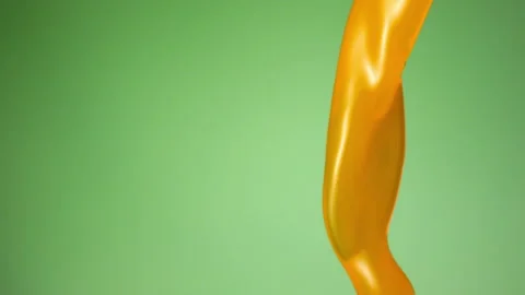 Orange juice falling over flat background Stock Footage 149131767