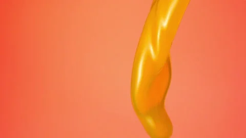 Orange juice falling over flat background Stock Footage 149132094