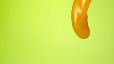 Orange juice falling over flat background Stock Footage 149132162