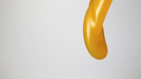 Orange juice falling over flat background Stock Footage 149132476