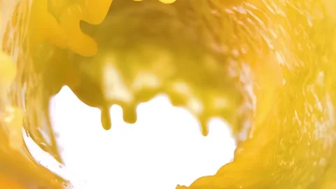 Orange juice flows, forming an attractive wave on a white background. Stock Footage 333315513