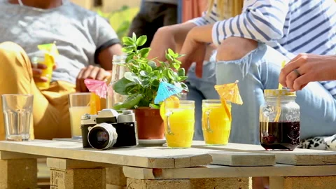 Orange juice in mugs on a table Stock Footage 140547766