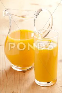 Orange juice in pitcher Stock Photos
