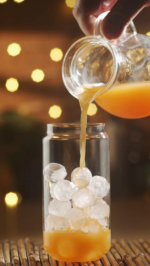 Orange Juice Pouring Over Ice For Bumble Coffee Stock Footage 337725555