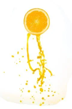 Orange juice splash Stock Photos