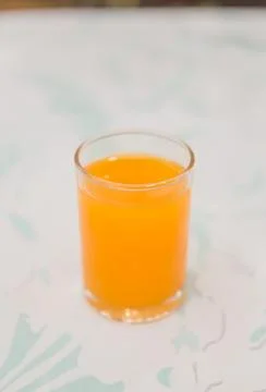 Orange juice on the table Stock Photos