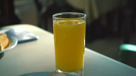 Orange juice takes on table. Preparing a breakfast from natural ingredients. Stock Footage 168580691