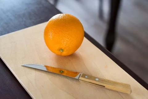 Orange on a kitchen table Stock Photos