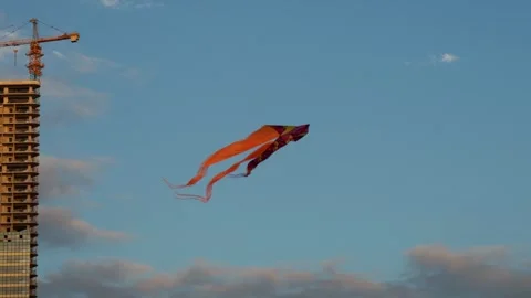Orange kite in the sky background of the house. Festival in the south. The conce Stock Footage 249227415