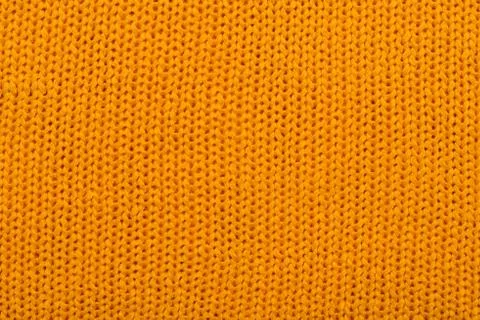 Orange knitted background Stock Photos