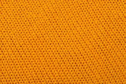 Orange knitted background Stock Photos
