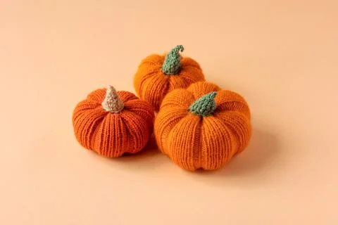 Orange knitted pumpkins Stock Photos