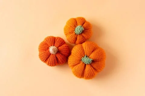 Orange knitted pumpkins Stock Photos