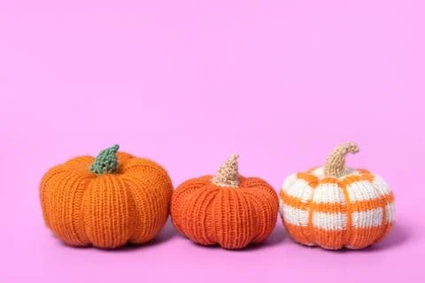 Orange knitted pumpkins Stock Photos