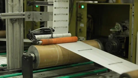 Orange Label Printing Rolls with High speed labeling machine in industrial Stock Footage 110771864