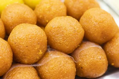 Orange Laddu texture closeup side view of Indian, pakistani and bangladeshi.. Foto stock