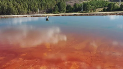 Orange lake. Ecological catastrophy. Stock Footage 129851580