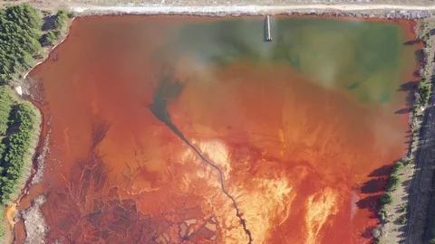 Orange lake. Ecological catastrophy. Stock Footage 129851811