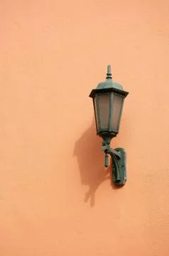 Orange lamp on wall Stock Photos