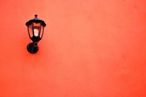 Orange lamp on the wall Stock Photos