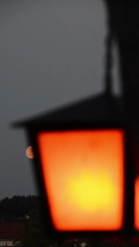 Orange lantern against a full moon background Stock Footage 261390250