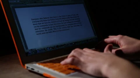 Orange laptop typing jib up &amp; down Stock Footage 47483781
