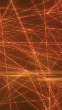 Orange laser lines intersect over a dark background forming a glowing network Stock Photos