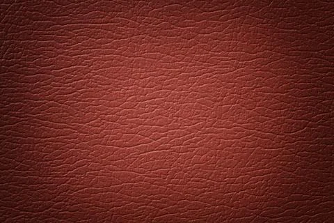 Orange leather texture background with pattern, closeup. Stock Photos