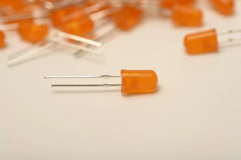 An orange LED on the background of a bunch of LED elements. One electronic LE Stock Photos