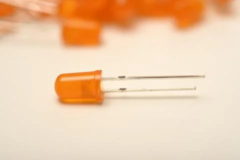 An orange LED on the background of a bunch of LED elements. One electronic LE Stock Photos