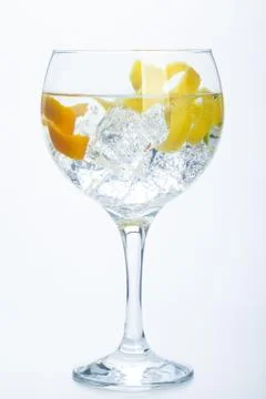 Orange lemon and lime gin tonic isolated over white Stock Photos