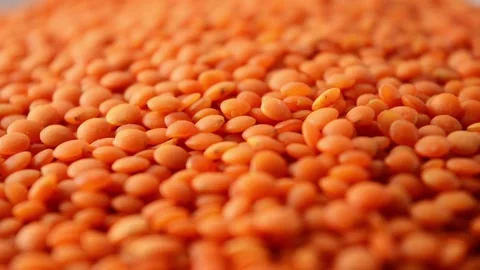 Orange lentils, side view. Slow rotation. Carbohydrate food. Stock Footage 267384951
