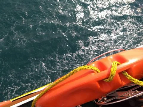 Orange life preserver on boat Stock Photos