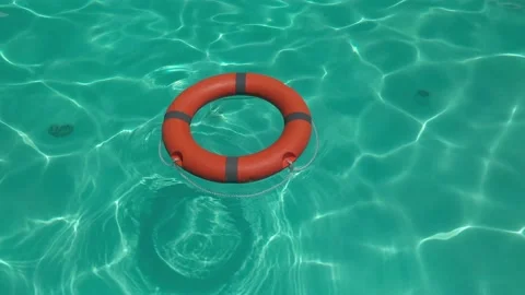 Orange lifebuoy on pool 스톡 동영상 155601223