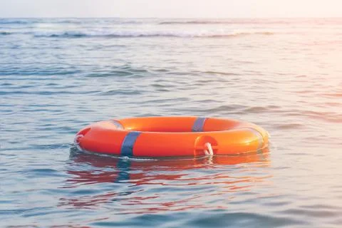 Orange lifebuoy pool ring float Foto stock