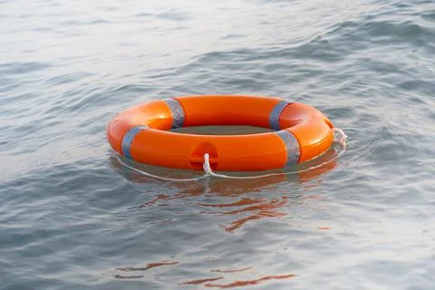 Orange lifebuoy pool ring float Foto stock