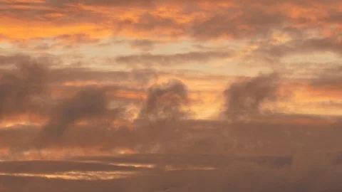 Orange light cloudy sky, evening glow, background Stock Footage 119323175