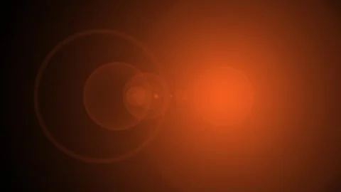 Orange light flares with bokeh and lens elements moving slowly against blac.. Video stock 341665037