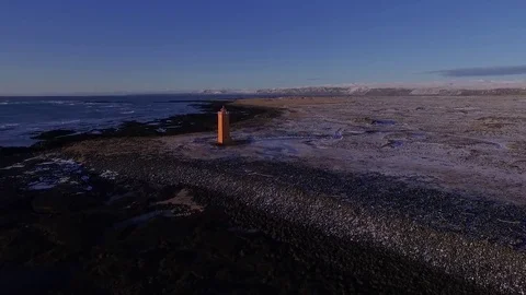 Orange Light House on deserted beach Stock Footage 82877423