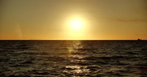 Orange light through to the cloud above the ocean Stock Footage 165587704