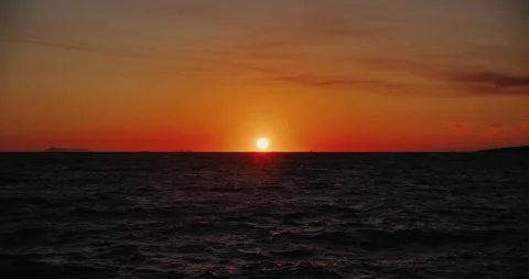 Orange light through to the cloud above the ocean Stock Footage 165591303