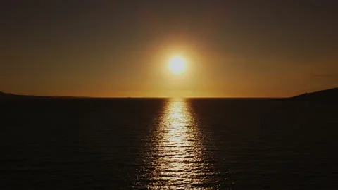 Orange light through to the cloud above the ocean Stock Footage 165628506