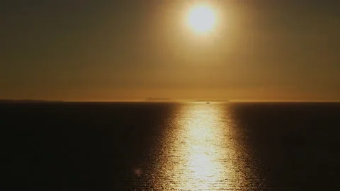 Orange light through to the cloud above the ocean Stock Footage 165628584