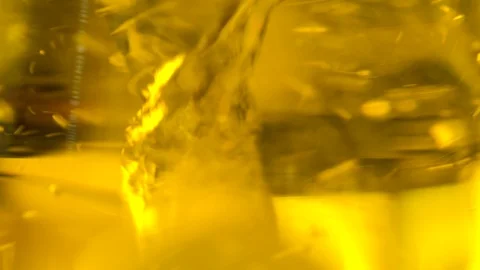 Orange liquid mixed inside a flask at a supplement laboratory, close up Stock Footage 101229584