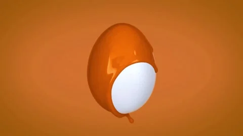Orange liquid slowly coating white egg surface against background Stock Footage 327594214